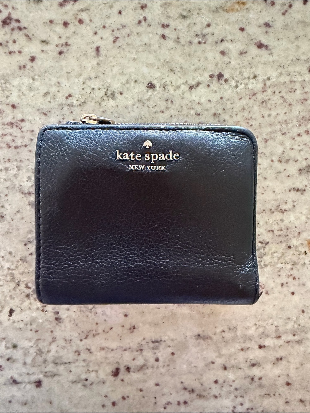 kate spade black leather zip-around wallet with gold logo